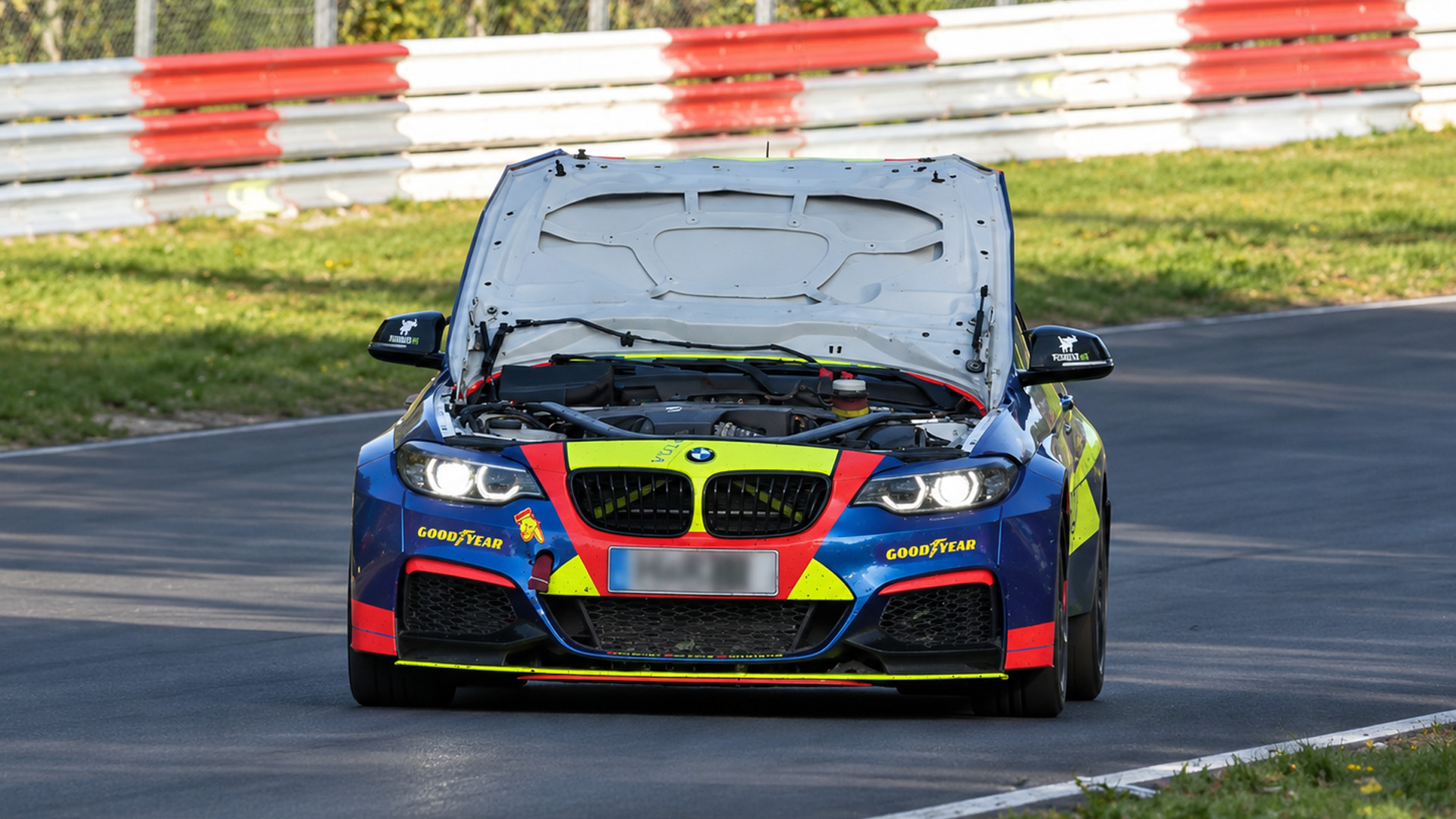 Fast race cars charge through the Nürburgring NLS 12h