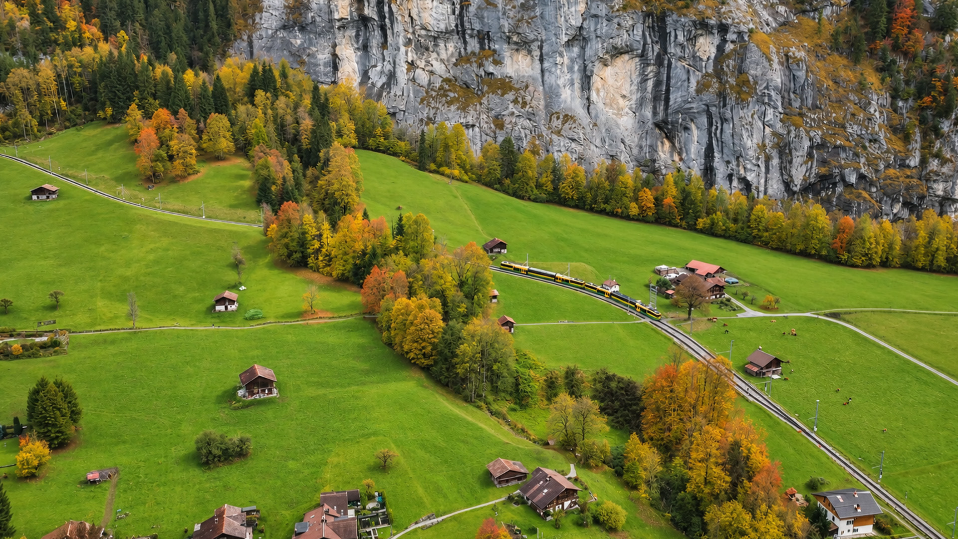 A Swiss village beneath an enormous stone wall