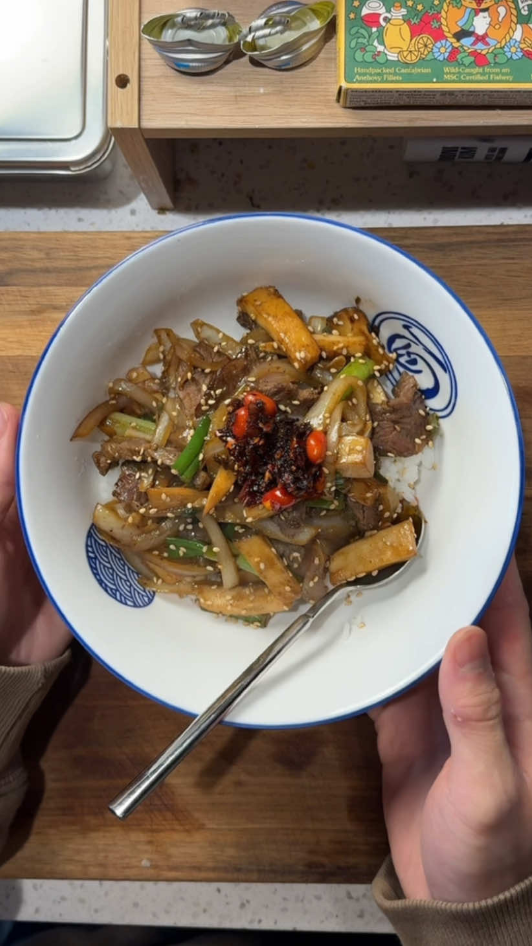 Beef stir fry rice bowl with mushrooms and chili oil