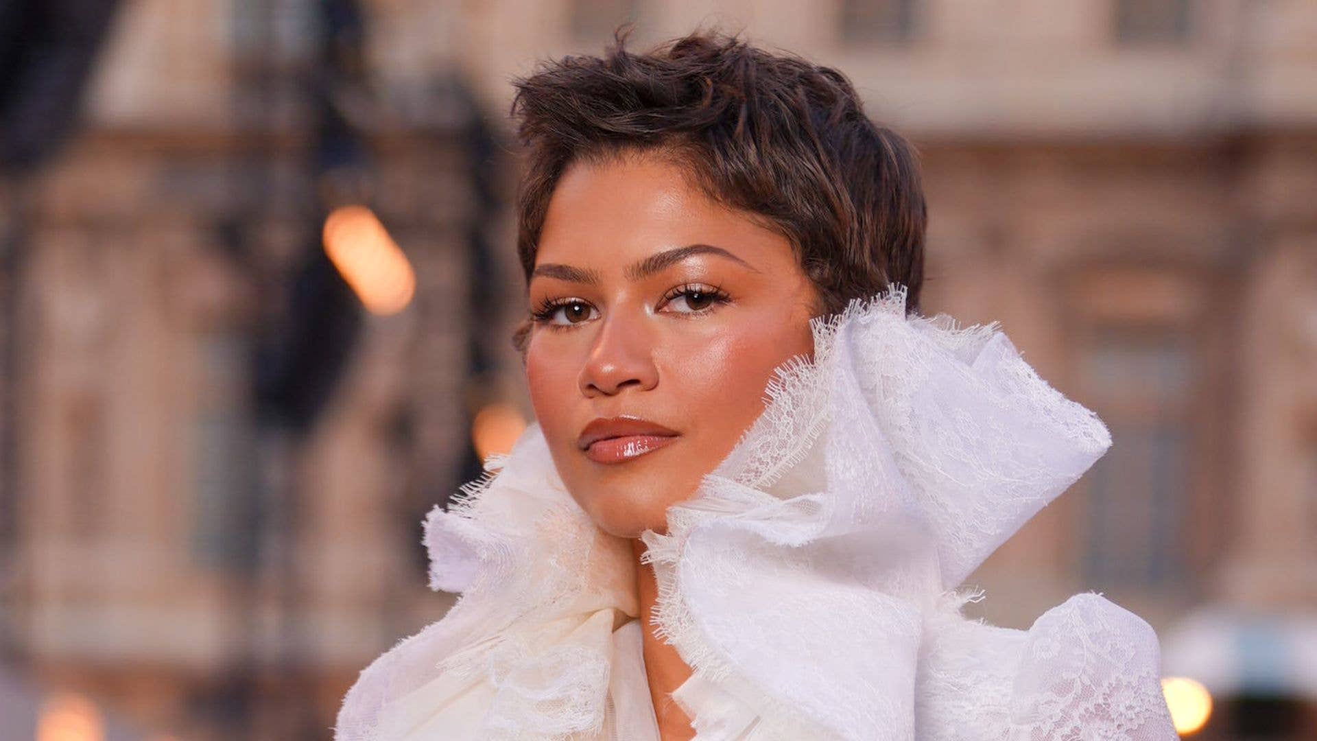 Zendaya poses in exquisite lace ensemble and curve-sculpting jeans ...