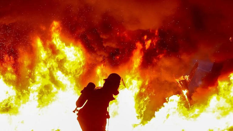 In pics: Durban unrest escalates as a home, business and motorbike set ...