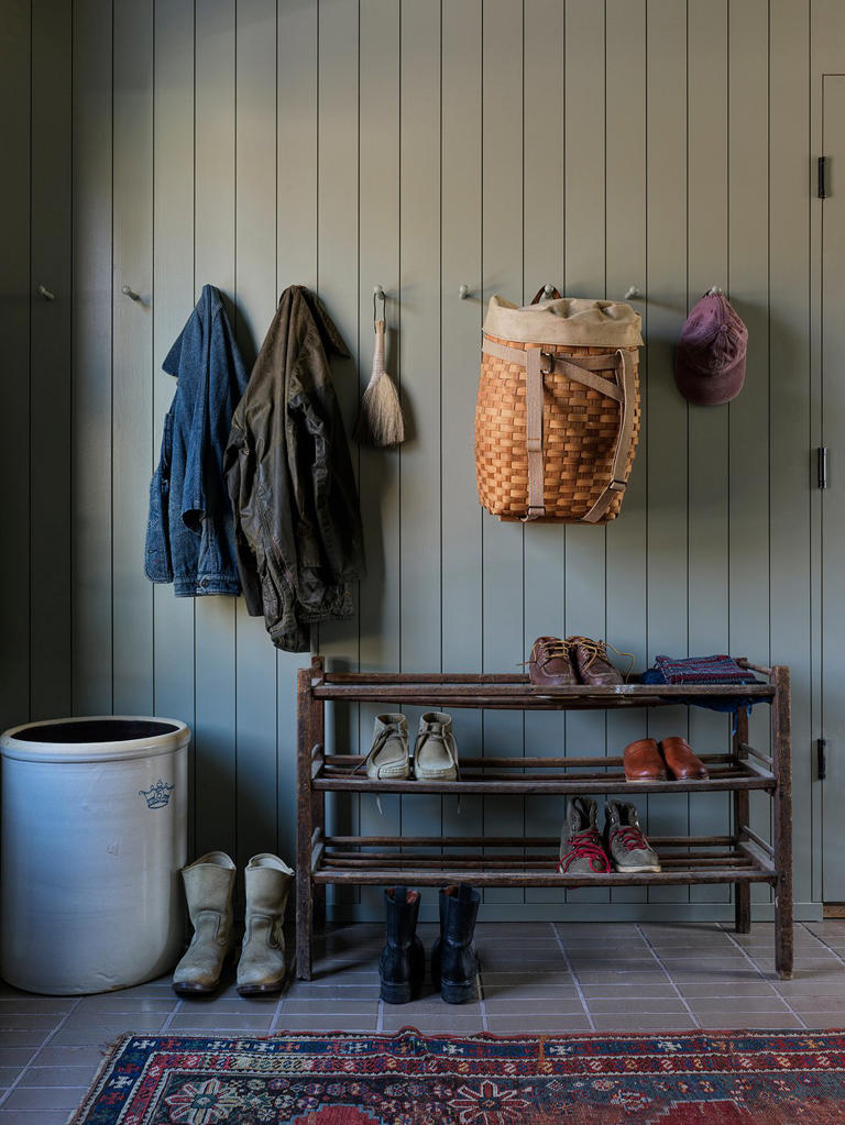 Tucked behind this 1950s Cape Cod? A modern two-story barn