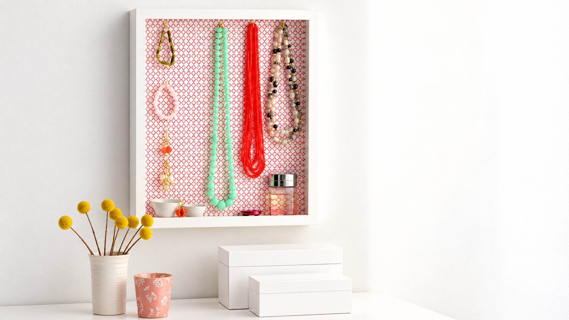 Keep your long necklaces tangle free with this framed wall organizer
