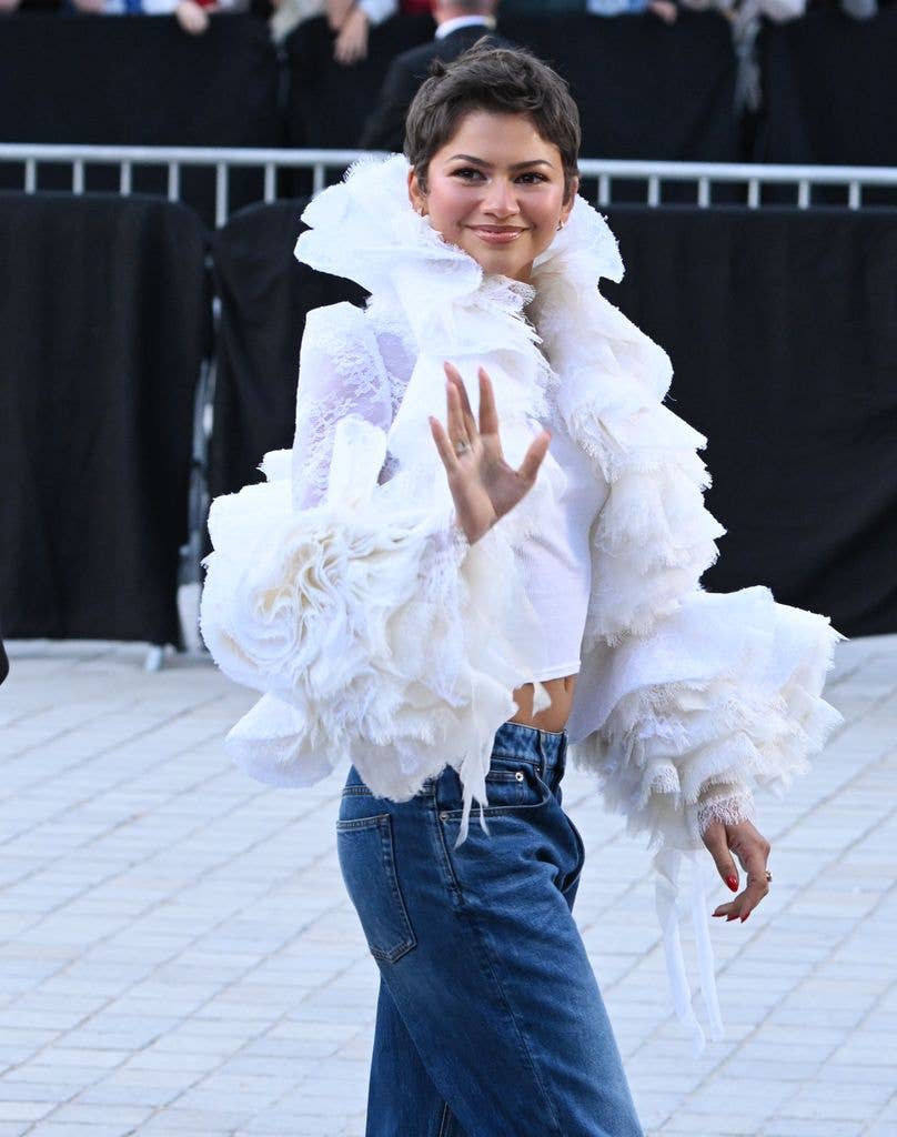Zendaya poses in exquisite lace ensemble and curve-sculpting jeans ...
