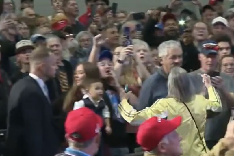 Trump calls protester 'paid political actor' as she flips the bird as ...