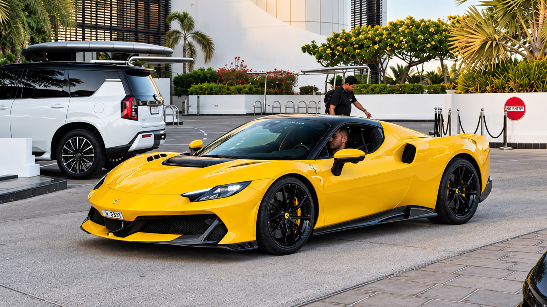 A millionaire’s Ferrari draws attention at the drop off