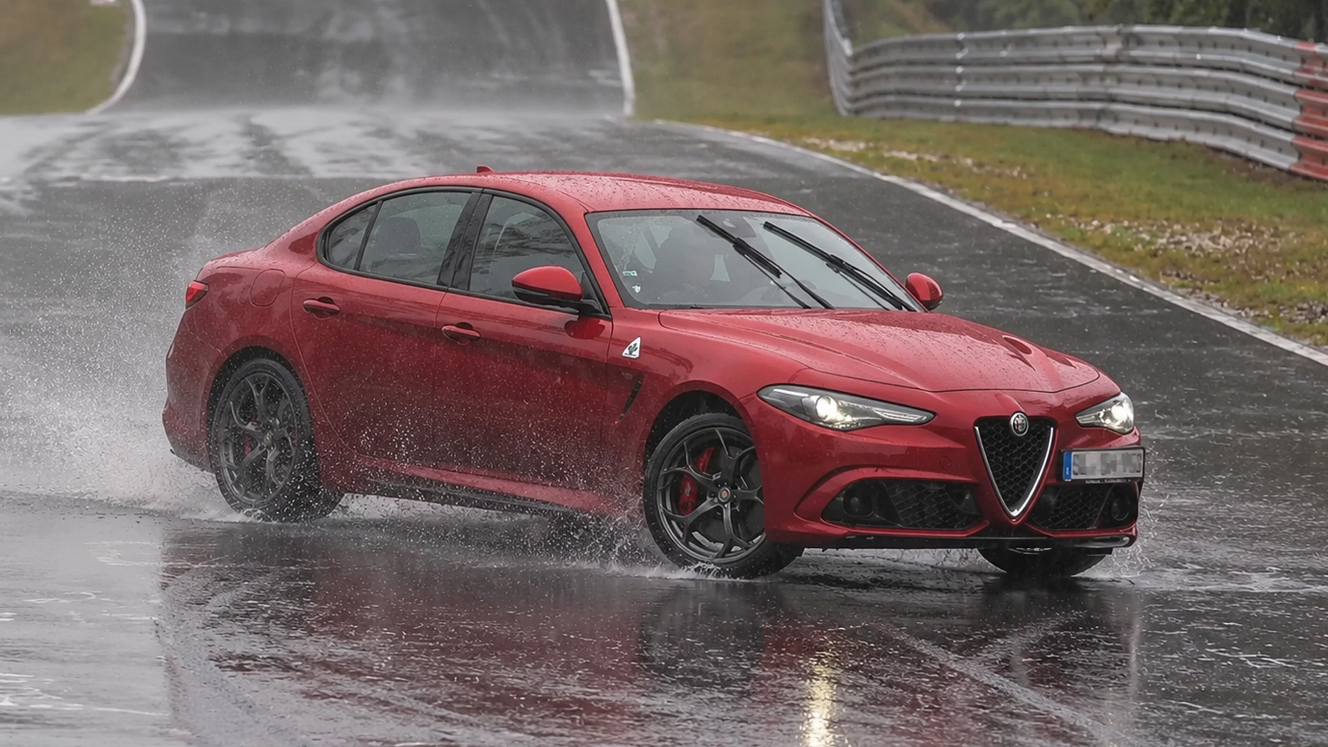 Drivers fight for grip across a soaked Nürburgring Nordschleife