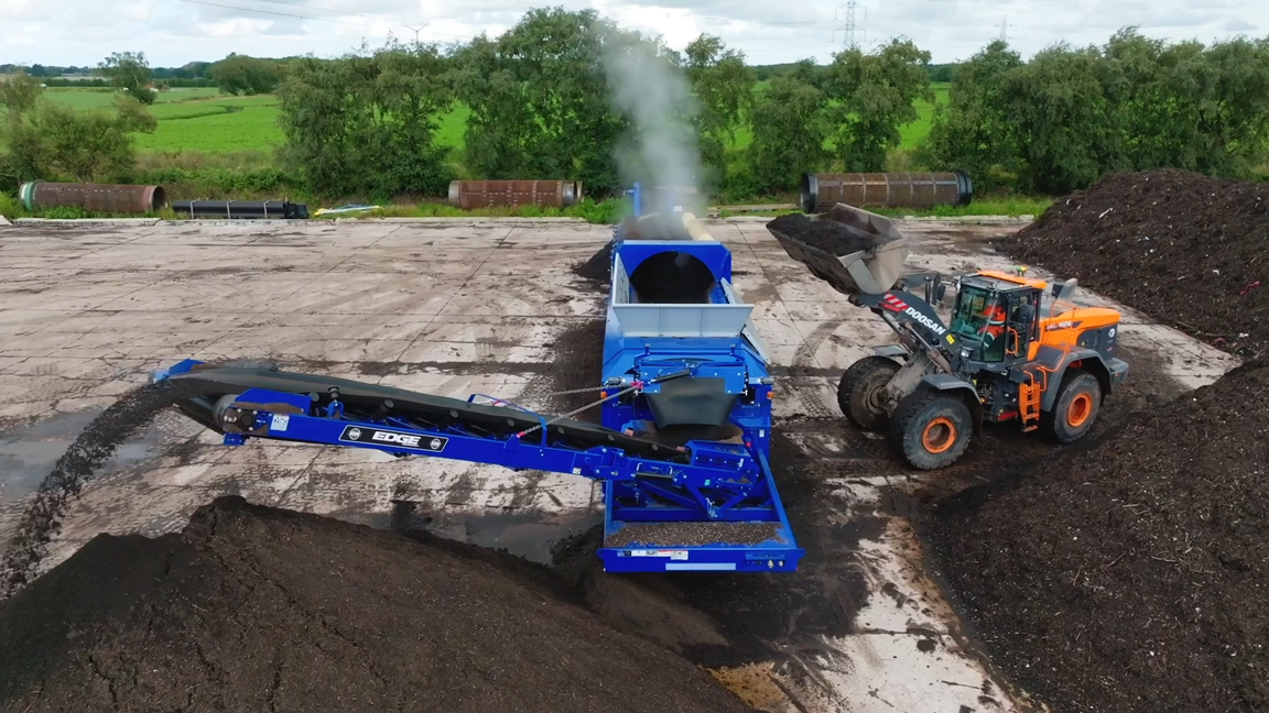 Powerful construction machines transforming wood waste into recycled ...