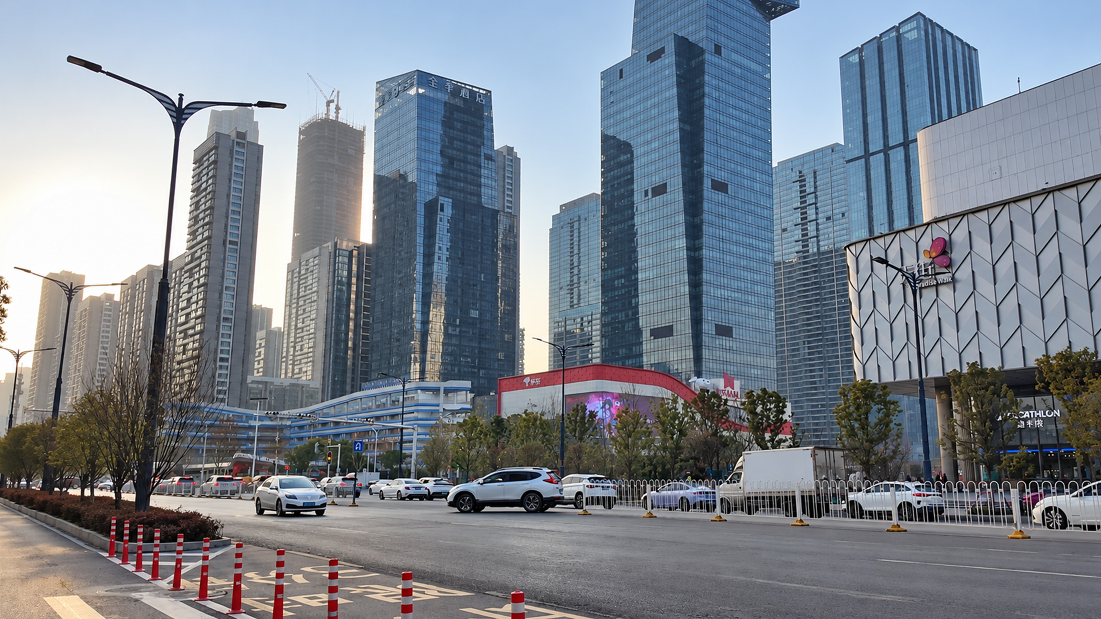 A modern shopping district sits beneath giant towers in China