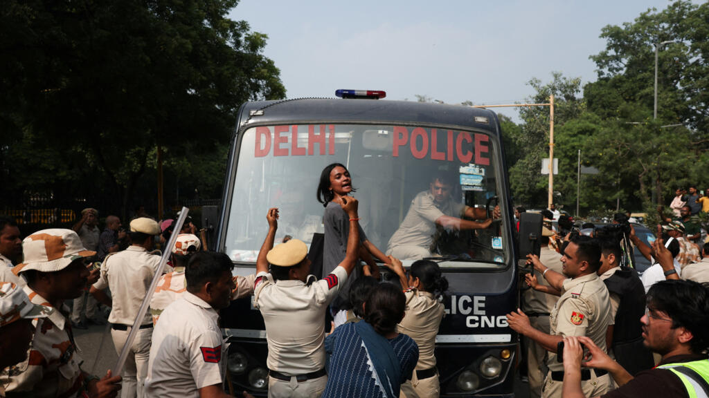 Indian police crack down on 'cockroach' movement protest in New Delhi