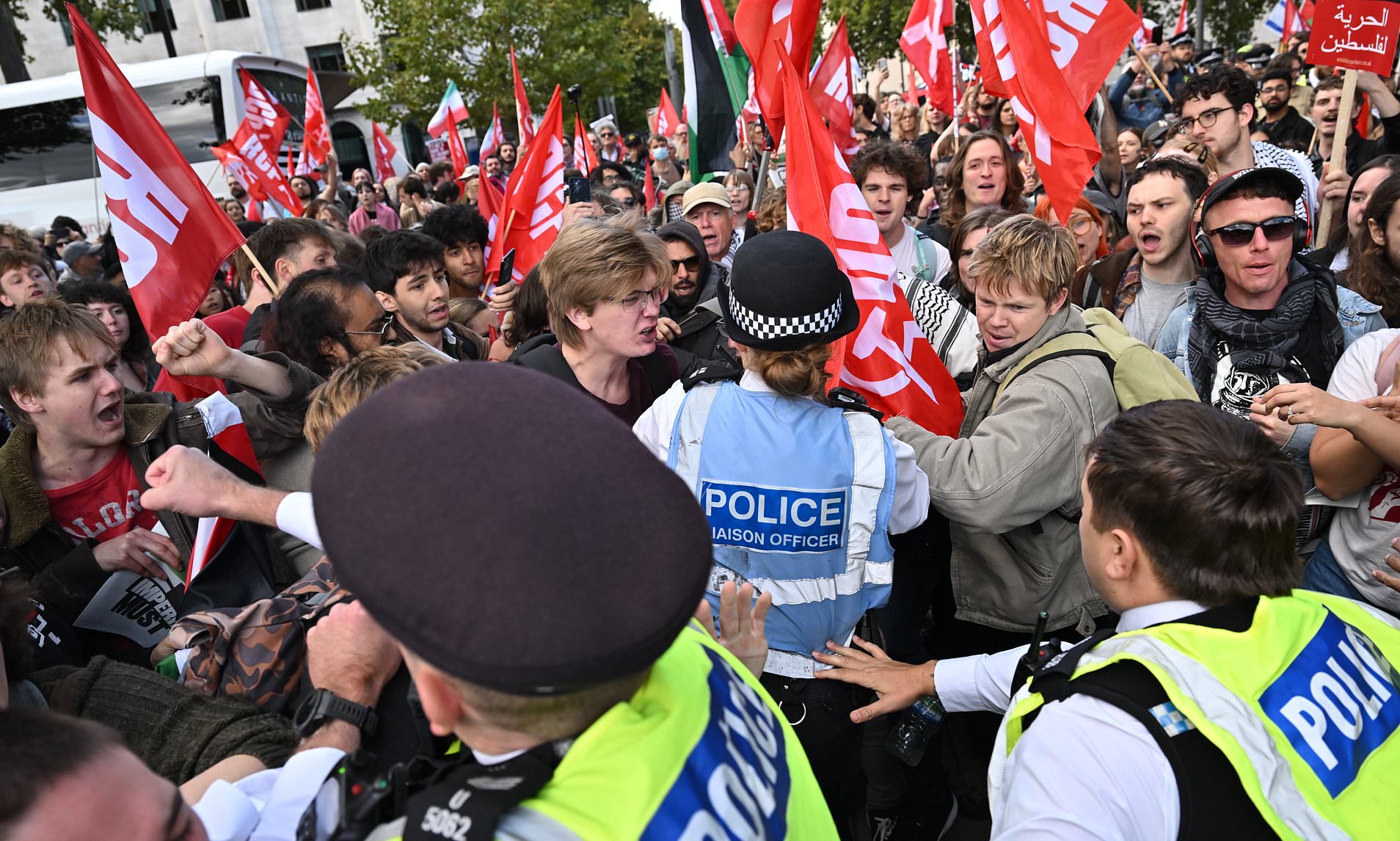 Pro-Palestine thugs spark fury as they stamp on poppies and climb over ...