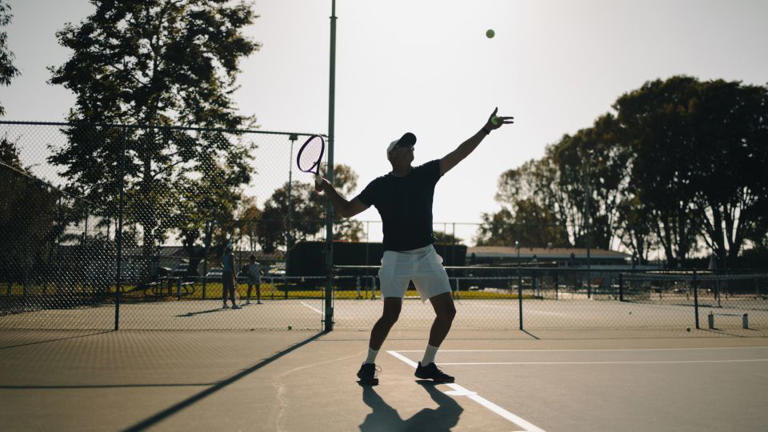 In addition to teaching math, Jeff works as a tennis coach for kids and adults. - Maansi Srivastava/CNN