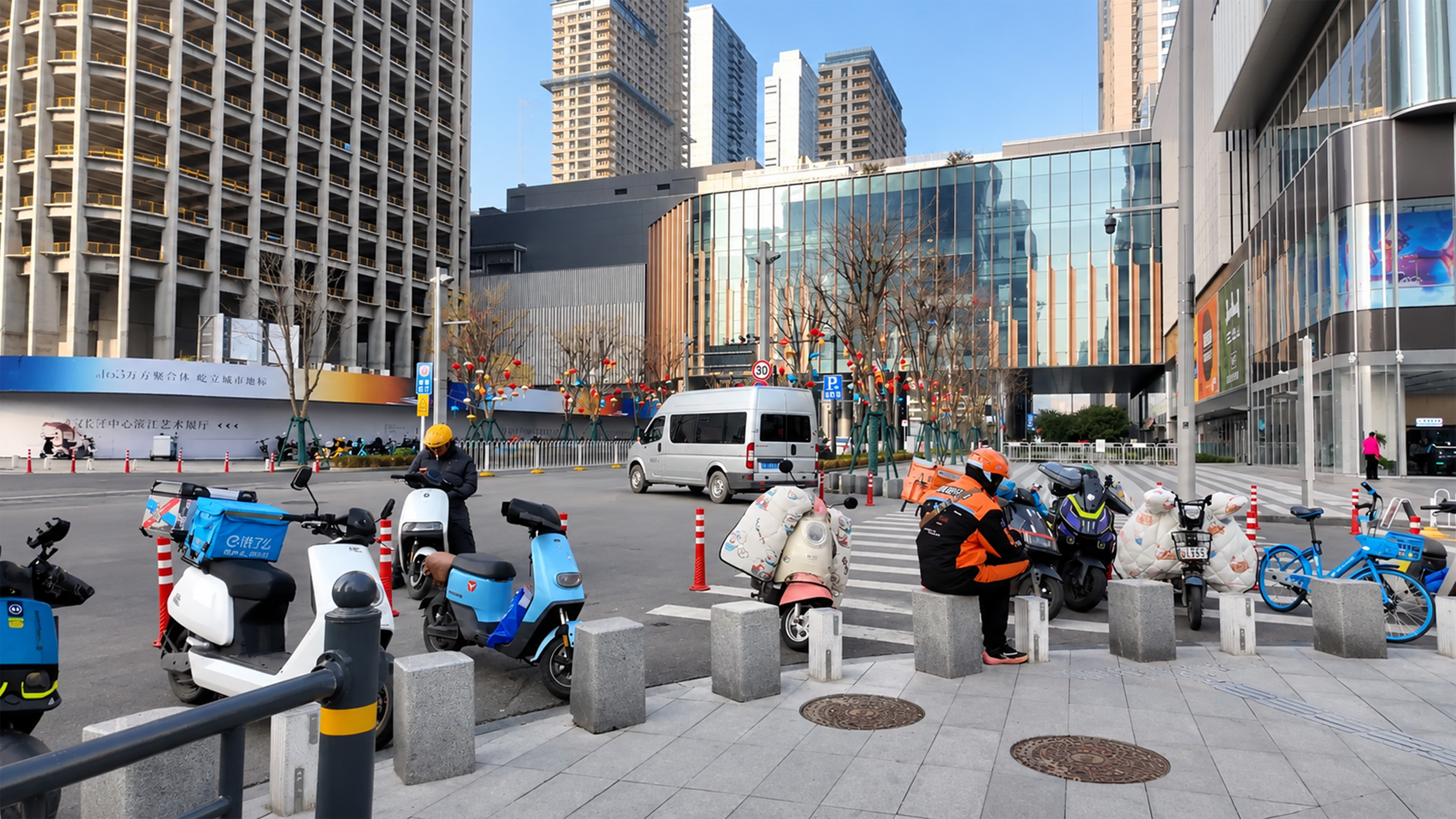 China’s modern towers rise behind everyday delivery scooters