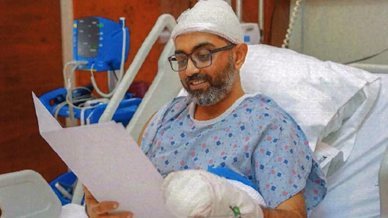 New images show Captain Smit reading Israeli president's letter in hospital