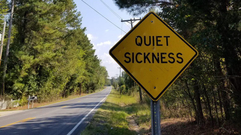 What does a road sign that says 'Quiet Sickness' mean?