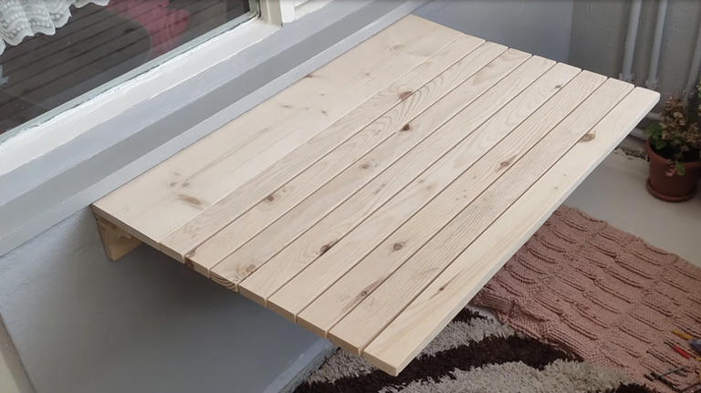 Man turns old wood pallets into a space-saving piece of furniture with ...
