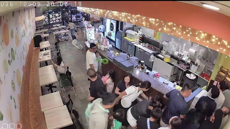 Surveillance video captures people running for safety after shooting in ...