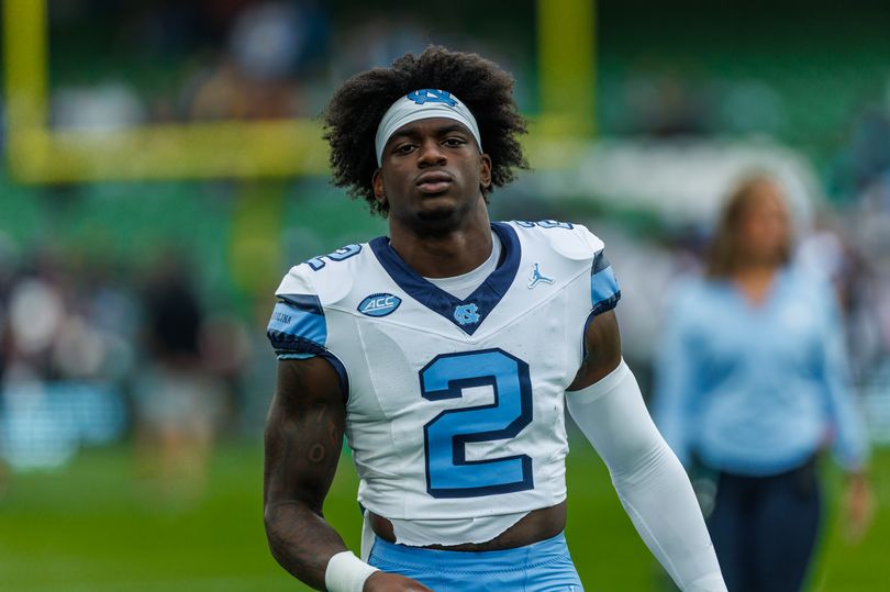 Stricken college football star narrowly misses fan after launching ...