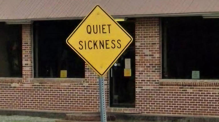 What does a road sign that says 'Quiet Sickness' mean?