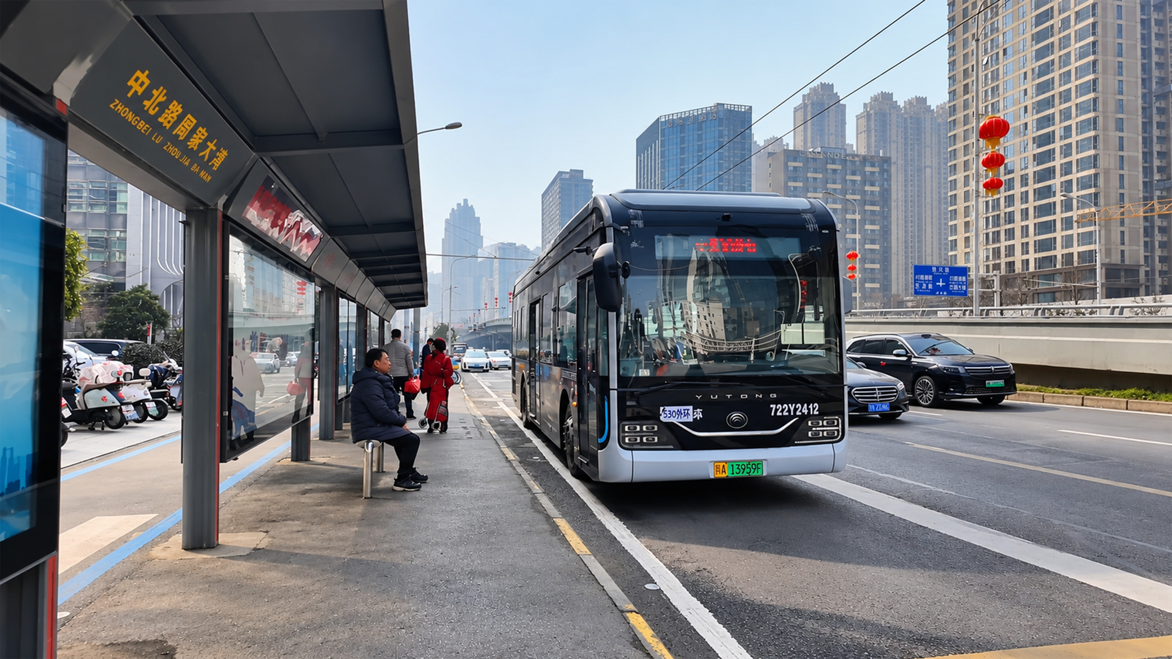 China’s modern city bus stops beneath giant towers