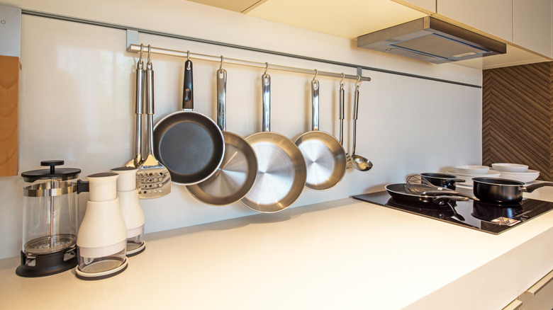 Skip basic racks: Keep pots organized & out of the way with an ...