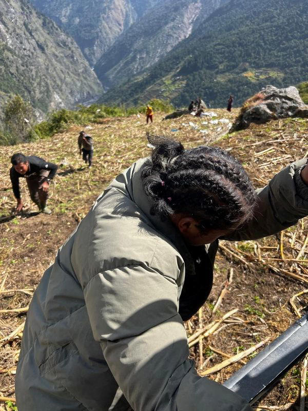 Nepal Army helicopter rescues people from areas affected by flooding of Budhi Gandaki River following a dry landslide in Chumnubri village, Gorkha district, Nepal, in this handout obtained by Reuters on October 11, 2026. Nepal Army/Handout via REUTERS