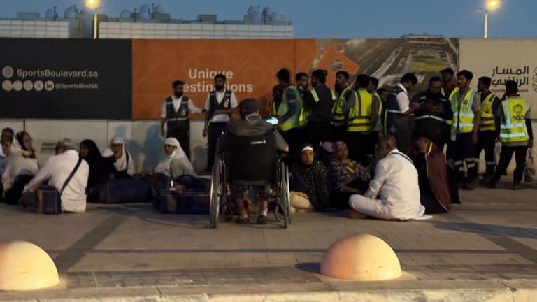 People gather outside a metro station on the road to King Khalid International Airport in Riyadh, Saudi Arabia, on October 10, 2026. - AP