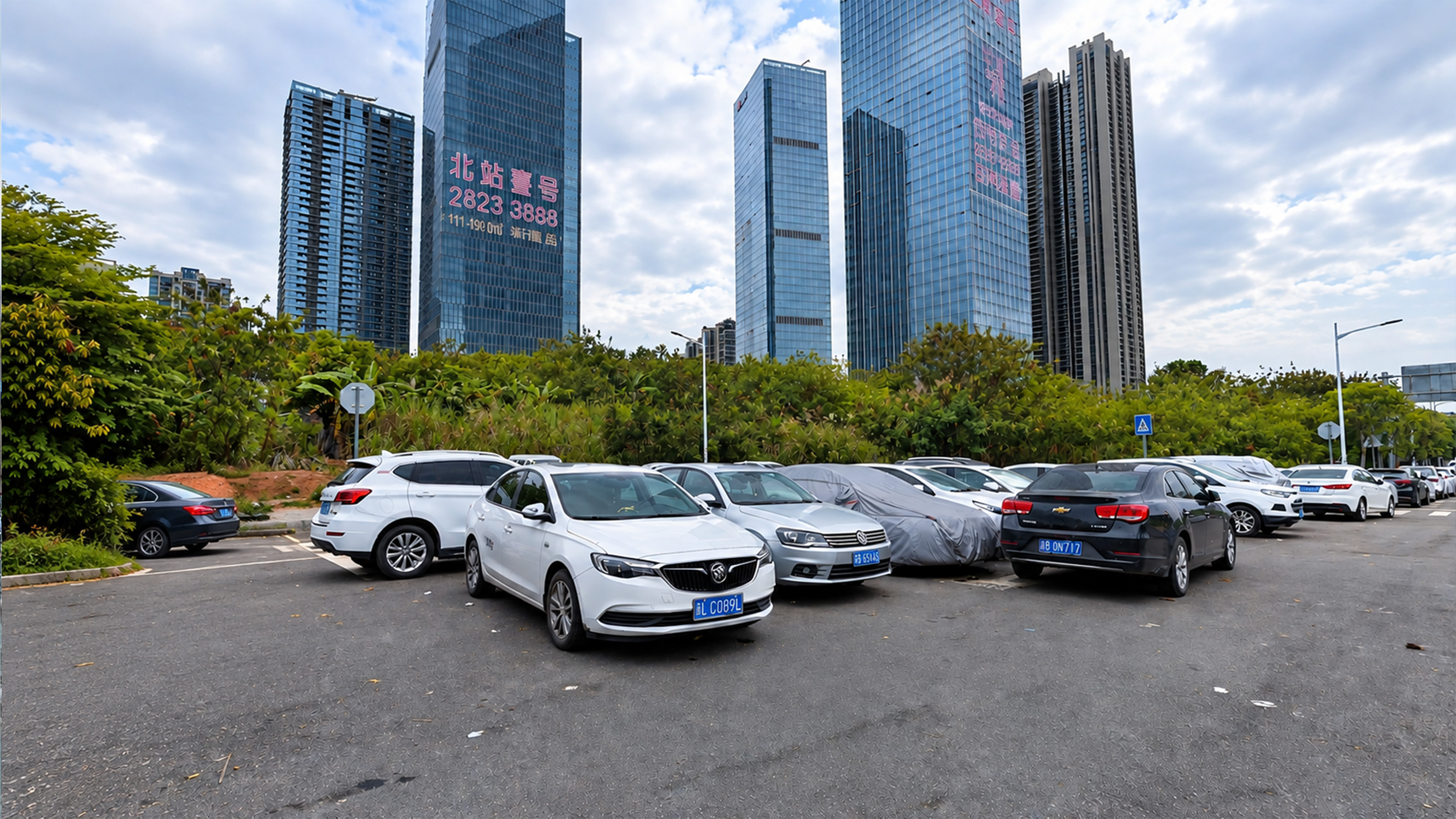 China’s giant glass towers rise behind everyday parked cars