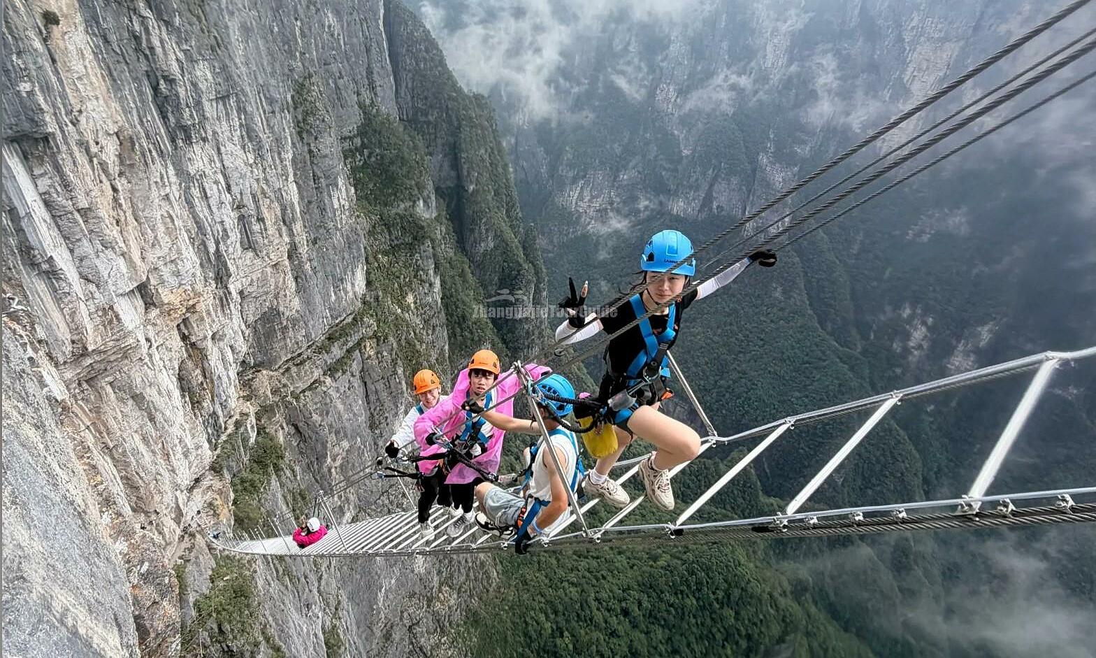 Heart-stopping experience climbing 1,500m-high China rope ladder