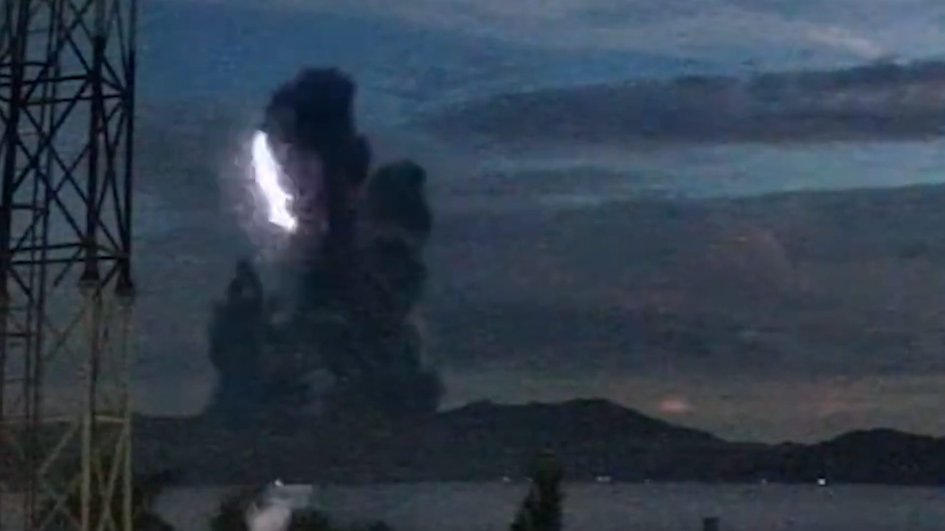 Lightning streaks through ash plume during Taal Volcano eruption