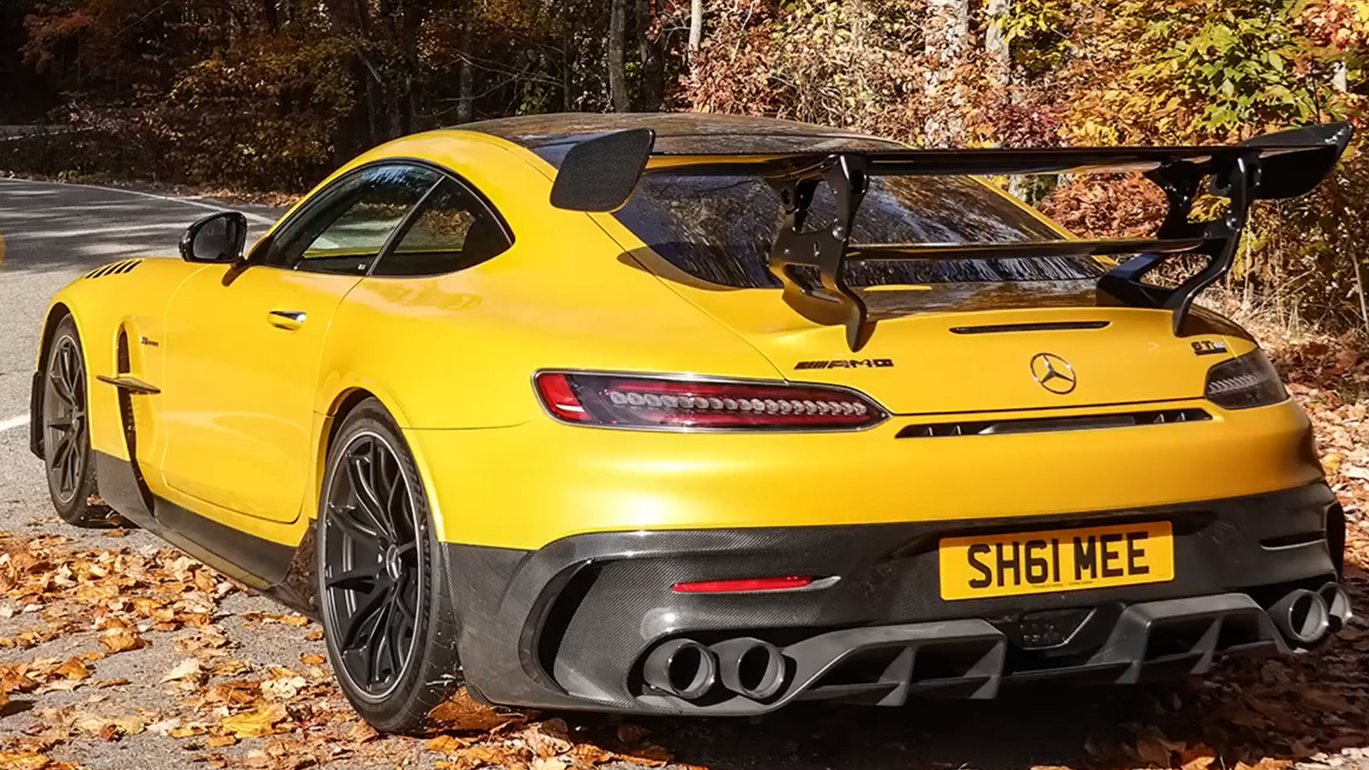 Mercedes AMG GT Black Series displays its rear wing on an autumn road