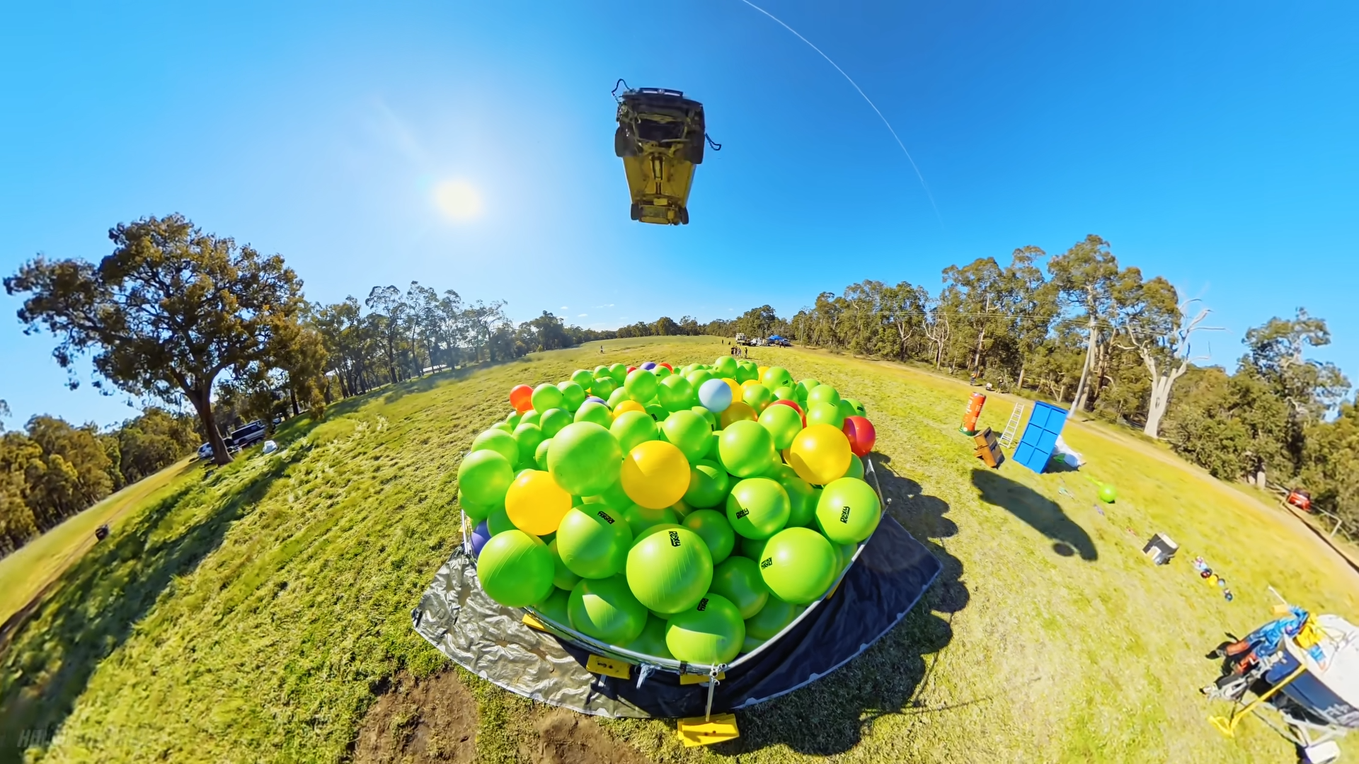 Dropping a car onto 1,000 exercise balls to see what happens on impact