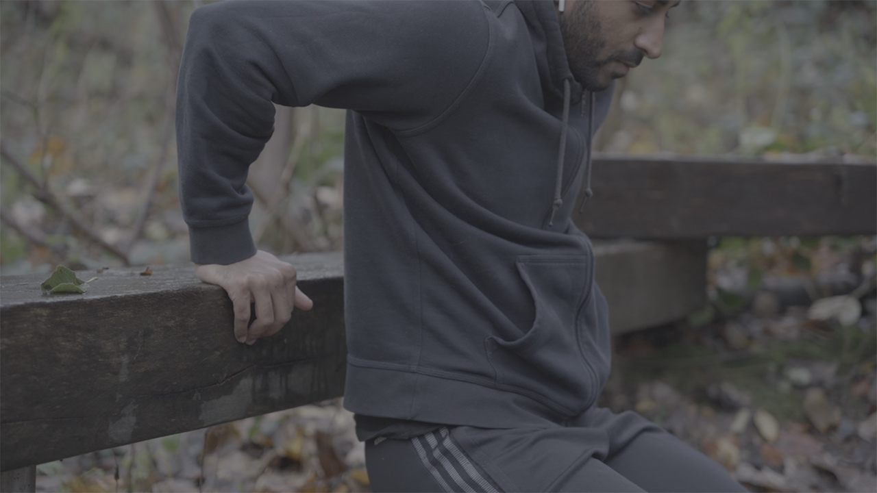 Performing bench dips to build stronger triceps outdoors