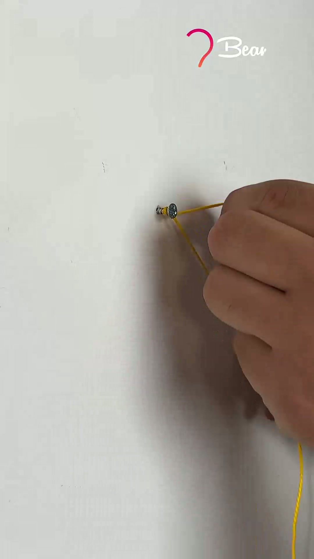 Picture hanging trick using string #easy #picture #hanging #trick