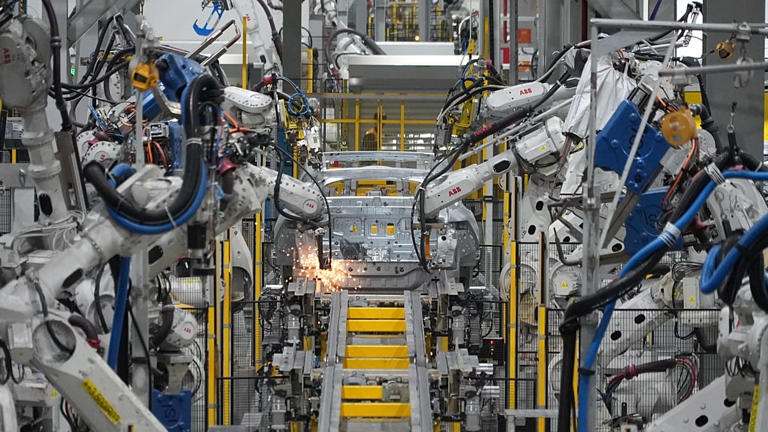 Five million robots now work in factories as humanoid hype faces ...