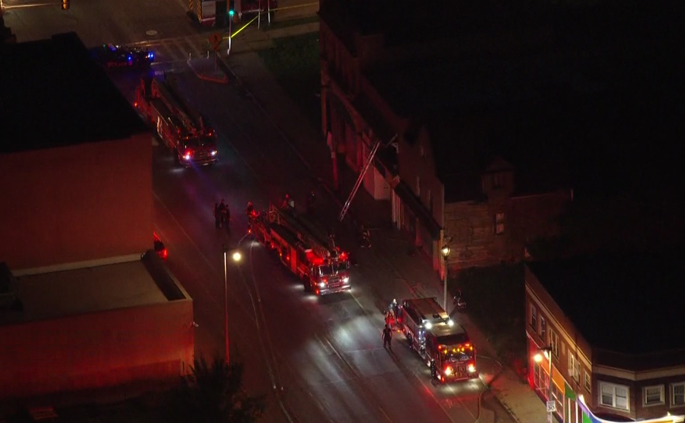 Milwaukee firefighters battle building fire, partial floor collapse