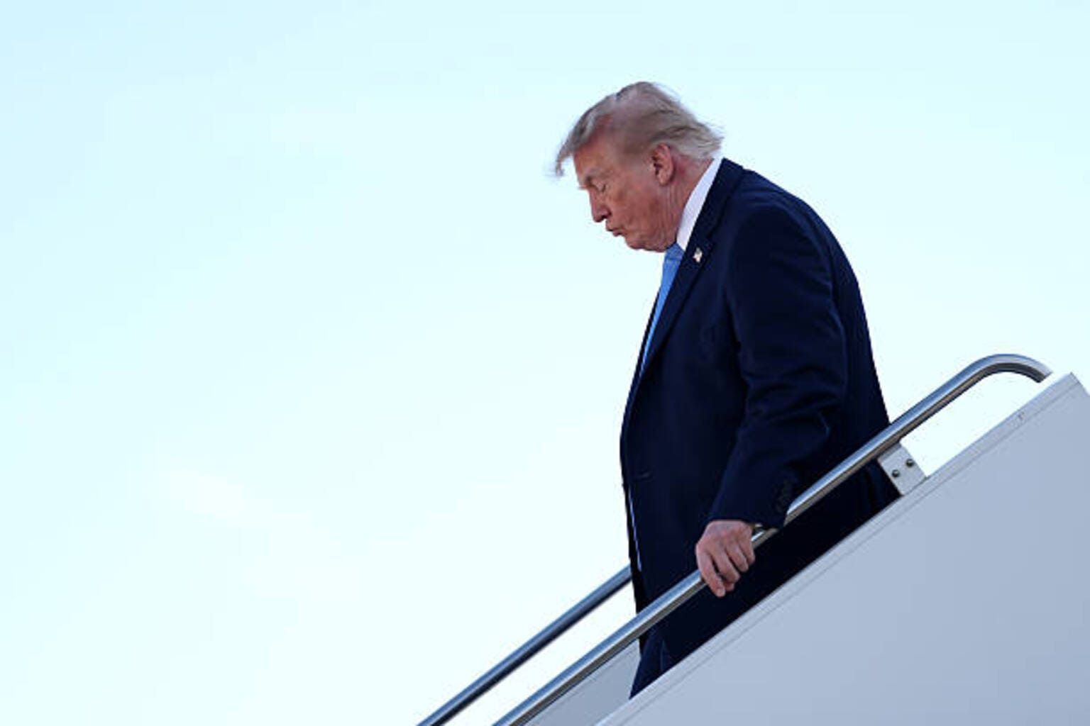 Trump denies report on potential sanctions relief for Iran