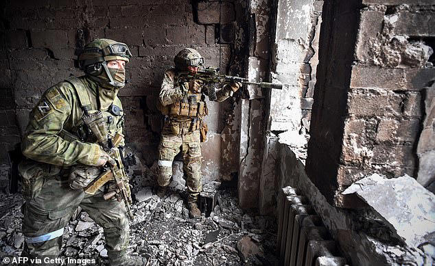Western intelligence services suggest Russia is losing 6,000 more soldiers than it can recruit every month (Pictured: Russian soldiers)