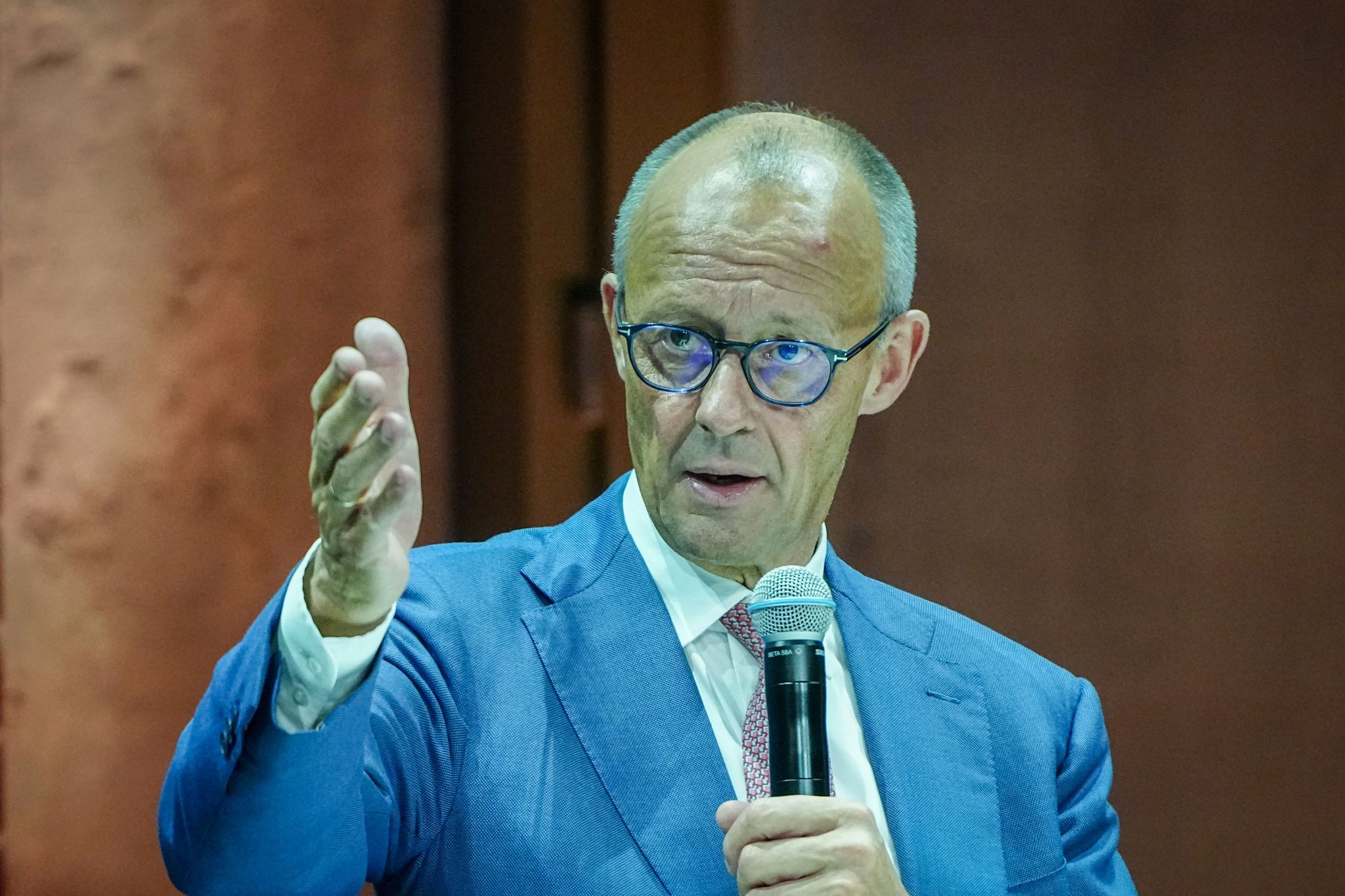 Merz announces sustainability plan, stresses risks of climate change