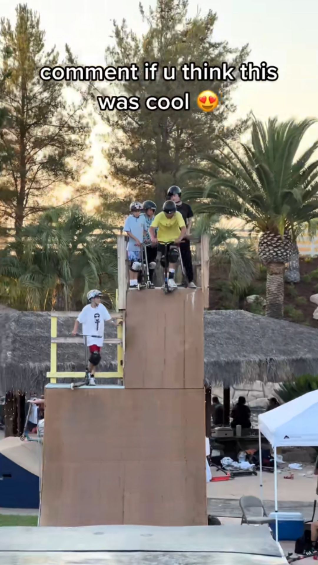 Scooter riders taking on a big ramp challenge