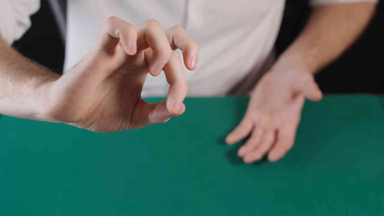 The coin touched his arm... then disappeared through the skin