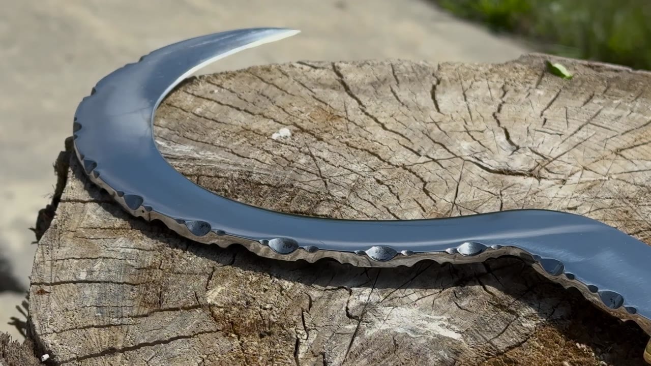 A giant ball bearing was forged into a razor-sharp sickle