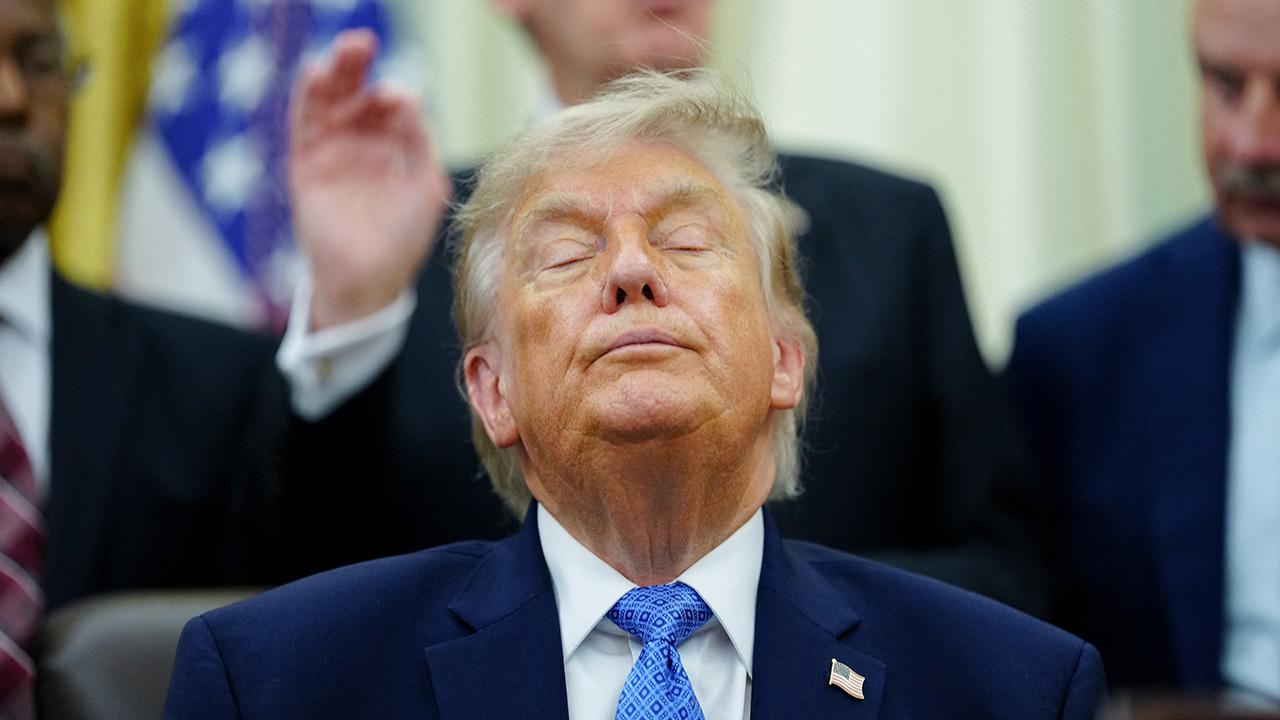 Donald Trump struggles to stay awake as he slumps over in his chair ...