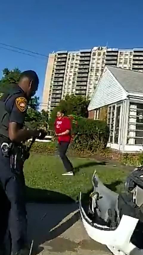 Officers remove ball python stuck in car grille