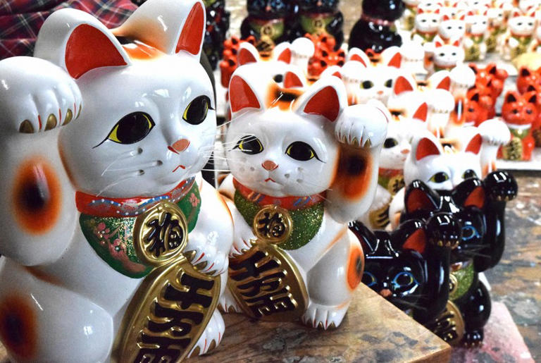Artisan behind big-eyed 'beckoning cat' pottery in Japan brings luck to ...
