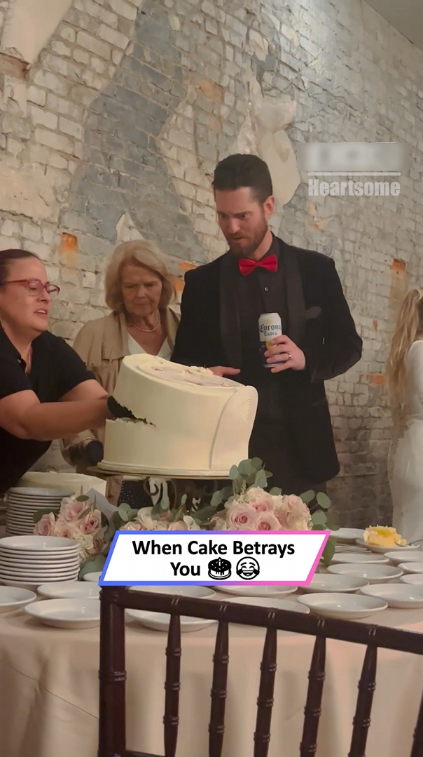 Visible bewilderment on groomsman's face during cake mishap at wedding