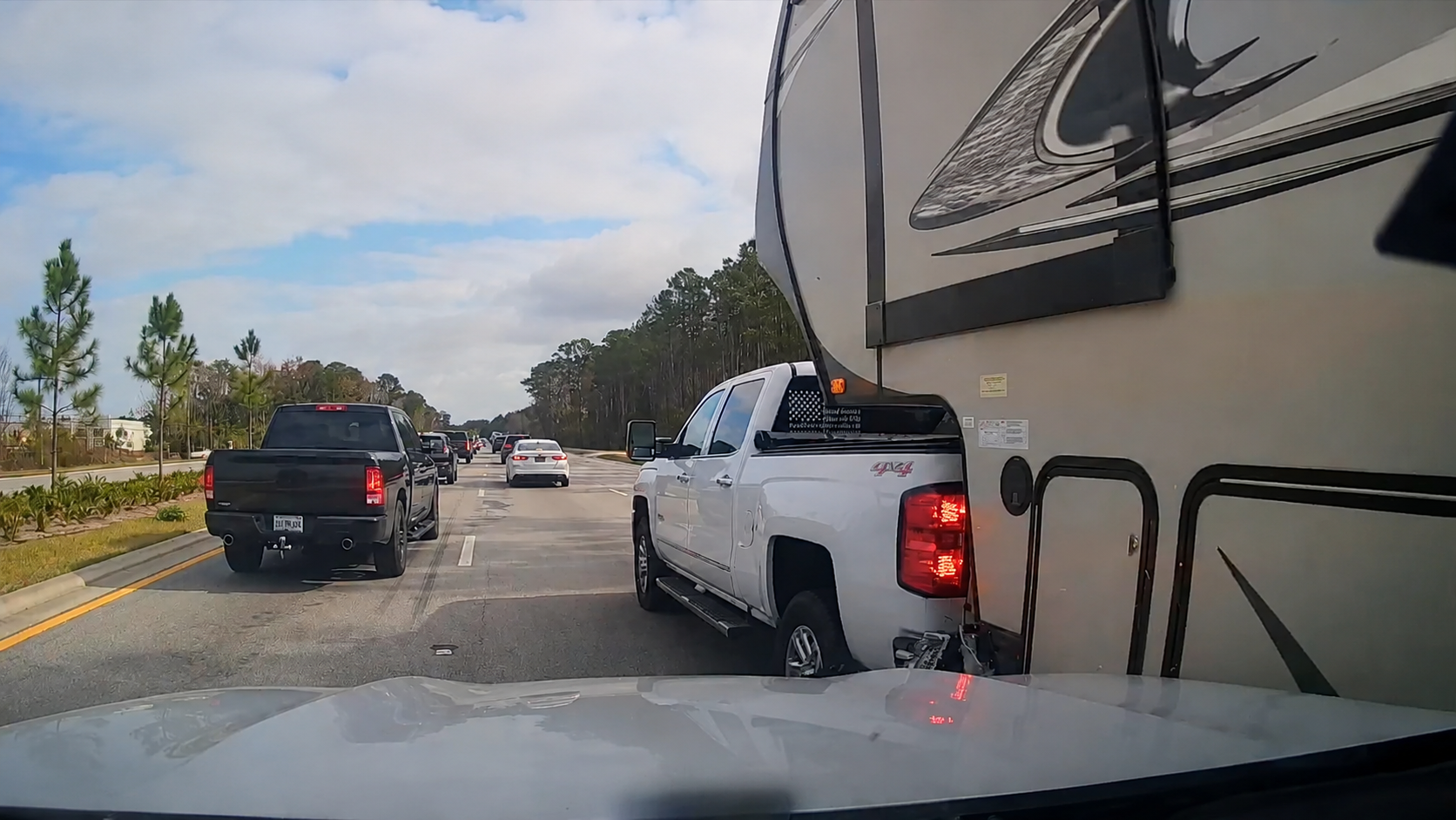 Pickup squeezes beside an RV - then the gap completely disappears