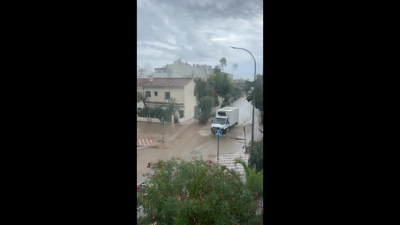 Flash flooding sends muddy water rushing through street in Torremolinos ...