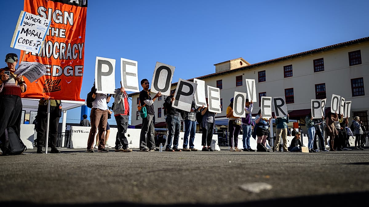 Let workers have a say: Protesters target OpenAI conference