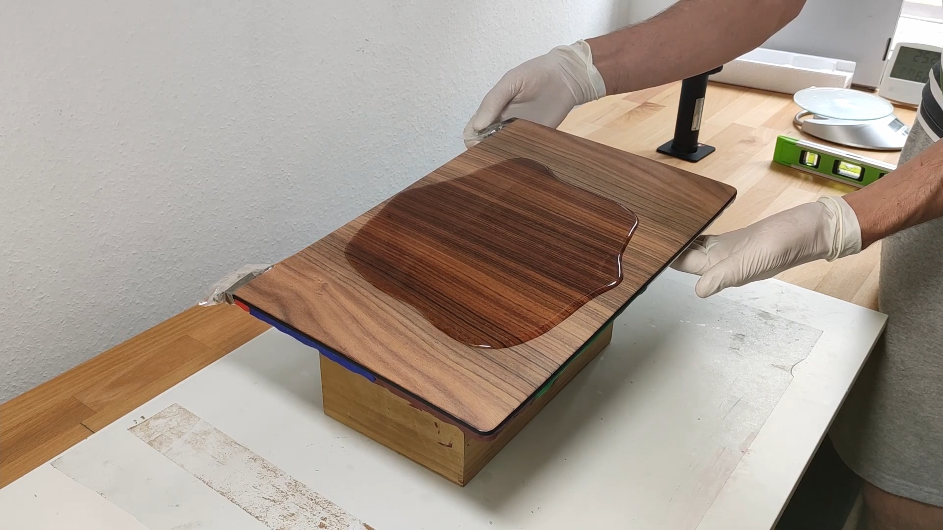 Will epoxy resin protect a custom wooden laptop surface?